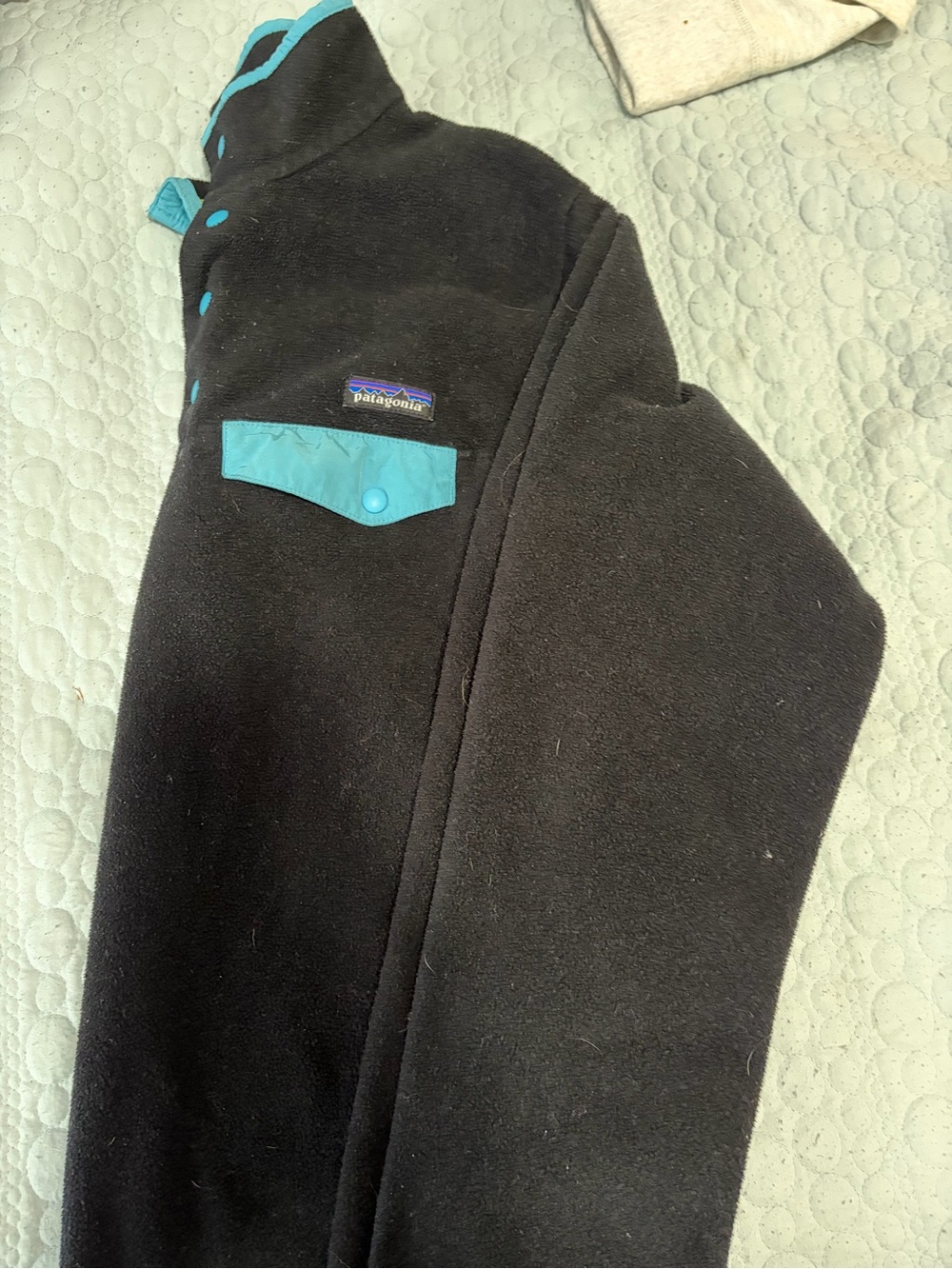 Patagonia Black Fleece Jacket with Teal Accents